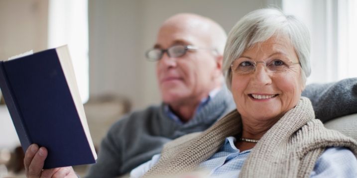 Photo of a senior woman reading a book