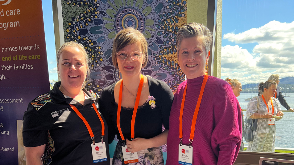 Photo of Rebecca Taylor and two other attendees at a Palliative Care Tasmania Conference in Hobart